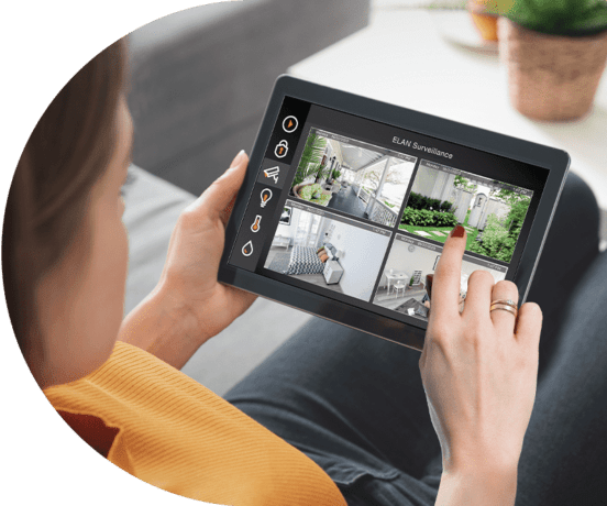 woman using security on tablet for Home Automation in Atlanta, Brookhaven, Fayetteville, Marietta, Newnan, Peachtree City